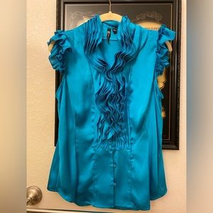 Turquoise short sleeve shirt with ruffles. Size medium.